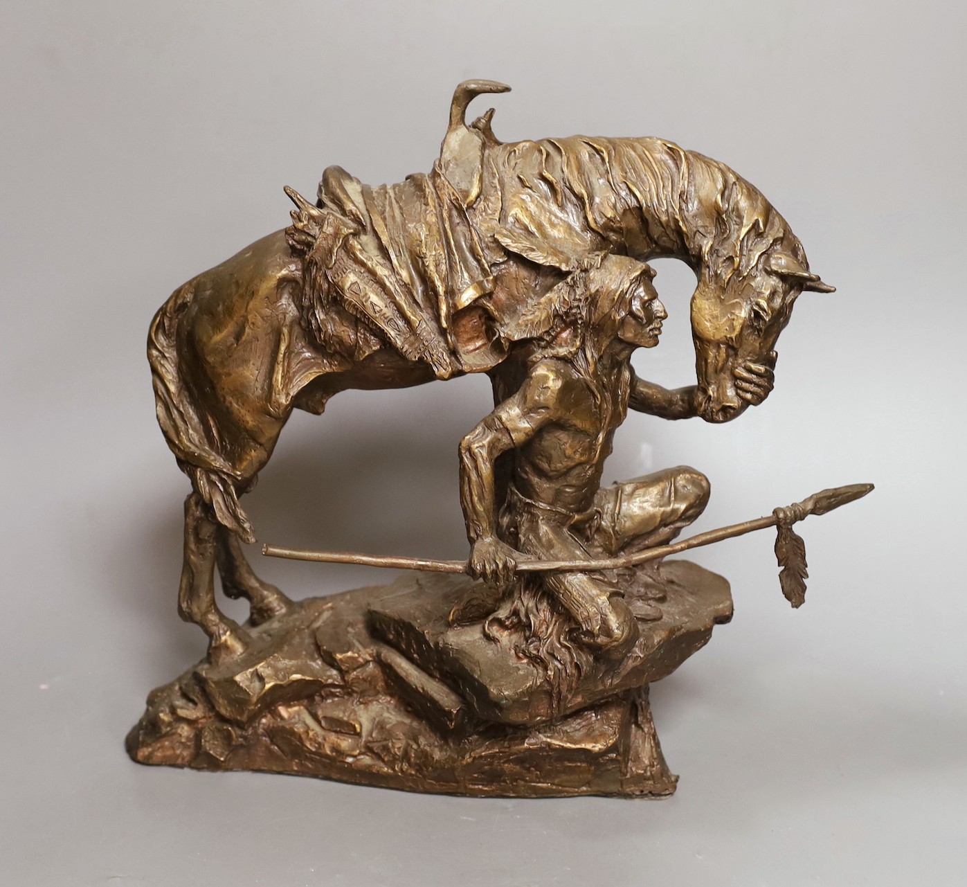 A bronze figure group of a Native American kneeling next to his horse - 'Protector of the Plains' by Buck McCain, 30cm